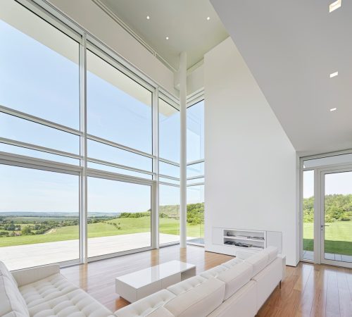 living-room-with-fireplace-couch-with-view-countryside Large
